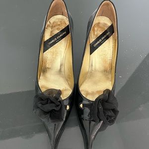 Charles Jourdan Patent Leather pumps with taffeta floral bow
